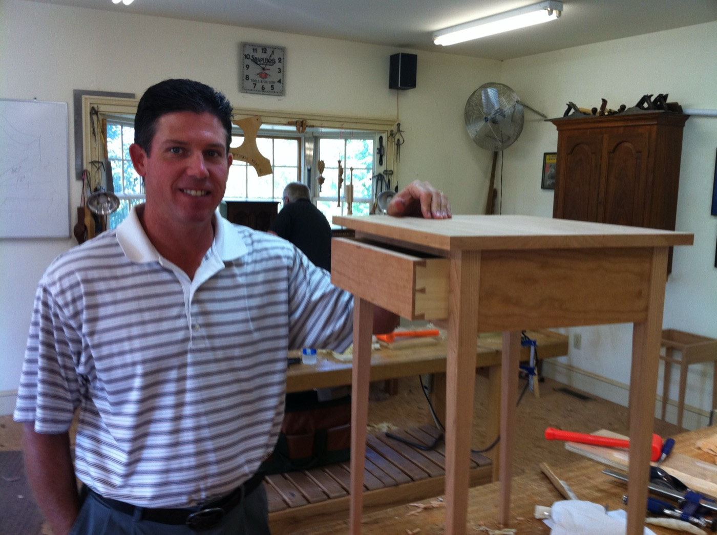 Dr. Barton with a Shaker-style side table he built, dovetail drawer open